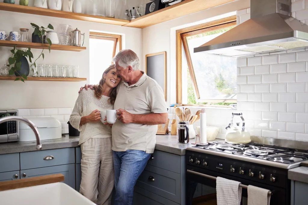 A couple in the kitchen of their byron bay home, northern rivers, nsw